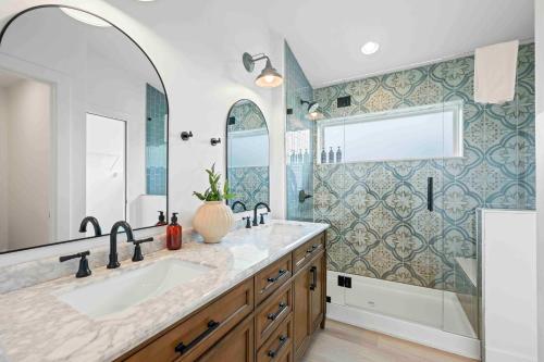 a bathroom with a sink and a large mirror at Dry Ridge Retreat - Near Ark - with Hot Tub in Dry Ridge