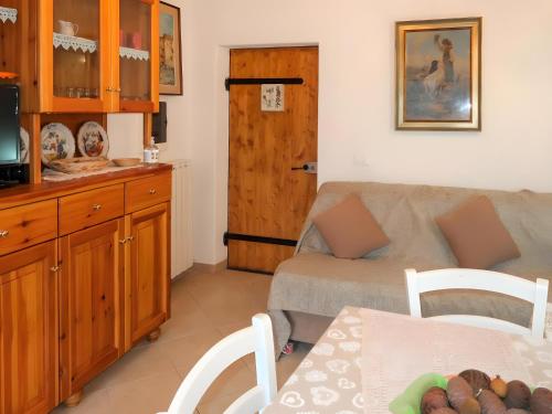 a living room with a couch and a table at Casa Reanna in Apricale