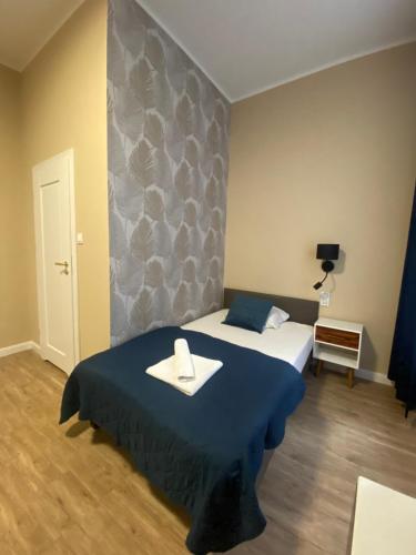 Postel nebo postele na pokoji v ubytování Hotel Kamil