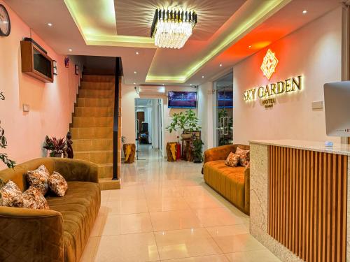 a lobby with two couches and a gym at Sky Garden Kandy in Kandy