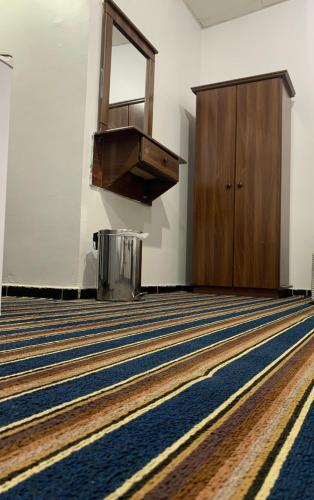 an empty church with a cross on the floor and a podium at فندق ألماس المغرب العربي - Almas Maghreb Hotel in Makkah