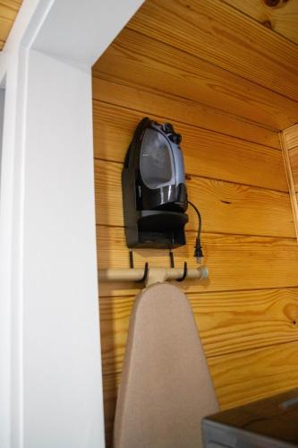 a tv hanging on a wall in a room at Priceless on Price St Walk to downtown! in Mount Airy