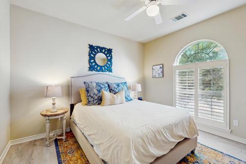 a bedroom with a bed and a window at Sacred Vista in Horseshoe Bay