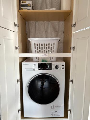 a washer and dryer in a small room at The Perfect Restful Retreat in Wareham