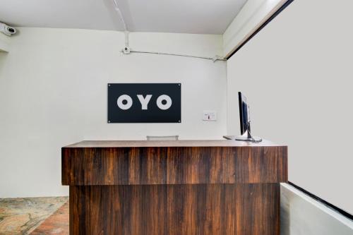 an office with a desk with a sign on the wall at Hotel O 5 Five Star in Upal