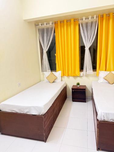 Letto o letti in una camera di Elite Stays Viman Nagar