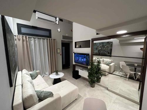 TV a/nebo společenská místnost v ubytování ANAVASI Loft SUITE