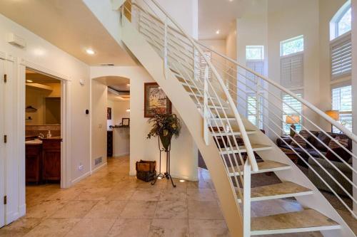 a white spiral staircase in a home with a kitchen at Beautiful Driggs Townhome with Views and Hot Tub in Driggs
