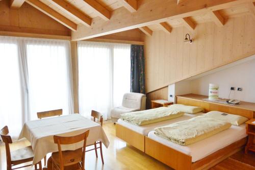 Posteľ alebo postele v izbe v ubytovaní Hotel Garnì al Plan