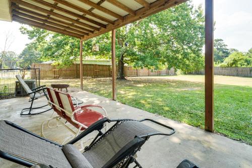 a group of chairs sitting on a patio at Screened Patio and Fire Pit Peaceful Marshall Home in Marshall