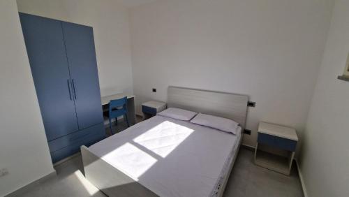 Ένα ή περισσότερα κρεβάτια σε δωμάτιο στο Residence Ferraro
