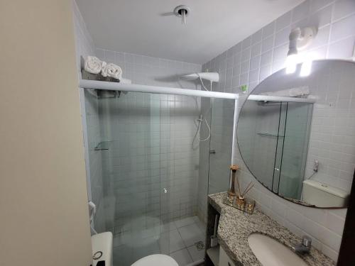 a bathroom with a shower and a toilet and a sink at Flat Hotel Fazenda Monte Castelo Gravatá in Gravatá
