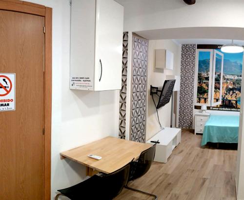 En eller flere senge i et værelse på Apartamento La Cueva