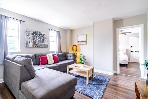 a living room with a couch and a table at Jungle House Columbus Downtown Free Parking Sleeps 6 - Steps to Convention Center & Nationwide Arena - 1BR Short North Luxury Home - Over 5,800 Five Star Stays in Columbus