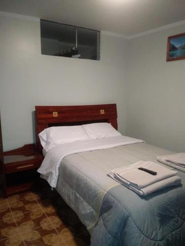 Ένα ή περισσότερα κρεβάτια σε δωμάτιο στο HOTEL SÚMAQ PUÑUY