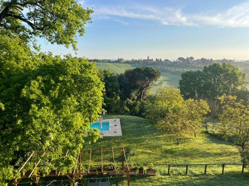 an aerial view of a field with a swimming pool and trees at Villa San Lorenzo - Lux Gated Estate/Private Pool in Gioiella