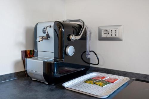 a espresso machine sitting on a counter with a keyboard at Lo Sarvanot in Bernezzo