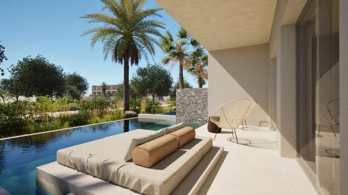 un soggiorno con divano e una piscina di ARATO by E-GEO, Adults Only a Città di Kos