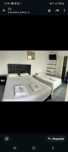 Postel nebo postele na pokoji v ubytování Hotel Pico Alto, La Planicie