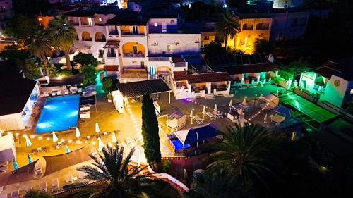 an aerial view of a hotel with a pool at night at Av Club Terme Colella in Ischia