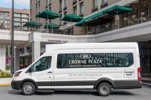 a white van parked in front of a building at Crowne Plaza Crystal City-Washington, D.C. by IHG in Arlington