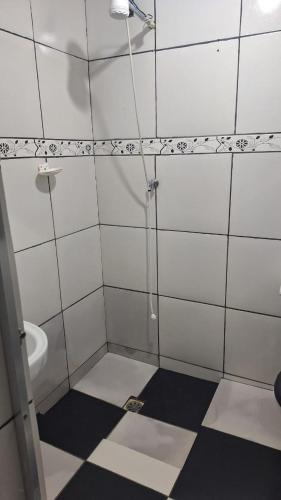 a bathroom with a shower and a toilet at Casa da Marlene in Resende