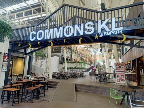 a restaurant with tables and chairs in a building at Eaton Delight Residences in Kuala Lumpur