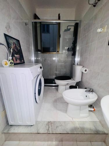 a bathroom with a toilet and a sink at Profumo di Sicilia Augusta in Augusta