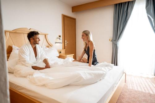 Un ou plusieurs lits dans un hébergement de l'établissement Piccolo Hotel