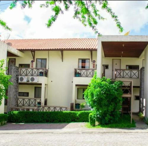 an image of a house with a building at Flat Monte Castelo Gravatá 2 Quartos Condomio Ao lado da Fazendinha in Sairé