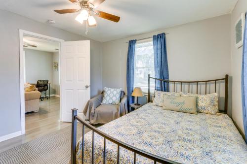 a bedroom with a bed and a ceiling fan at Beachy Home in Heart of Beaufort with Pool Access in Beaufort