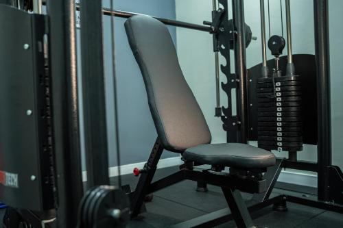 a gym with a gray chair in a gym at ibis Copacabana Posto 5 in Rio de Janeiro