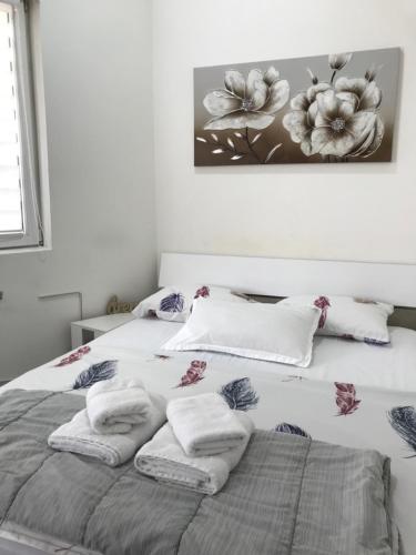 a bedroom with two beds with towels on them at Luna in Kragujevac