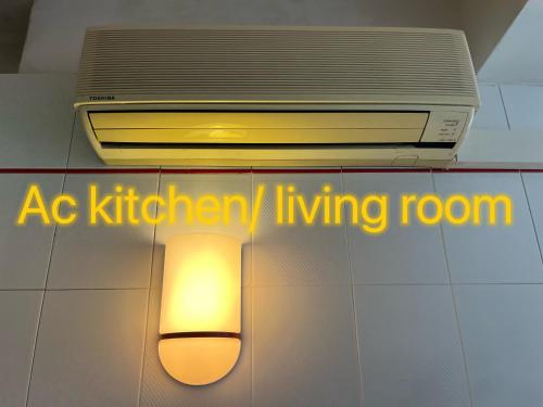 a light hanging from a ceiling with the words kitchen living room at Luxury Relax Apartment near Venice Station in Venice
