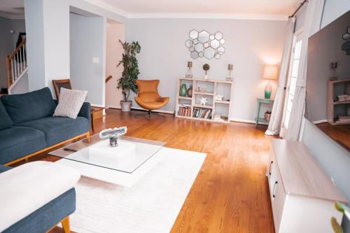 a living room with a couch and a table at Cozy Stay Springfield Townhome in Springfield