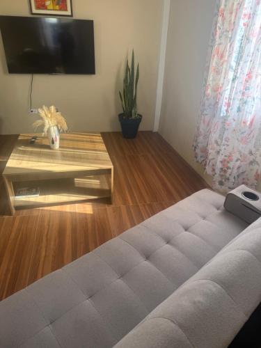 a living room with a couch and a table at Vacation Rental in Paix Bouche