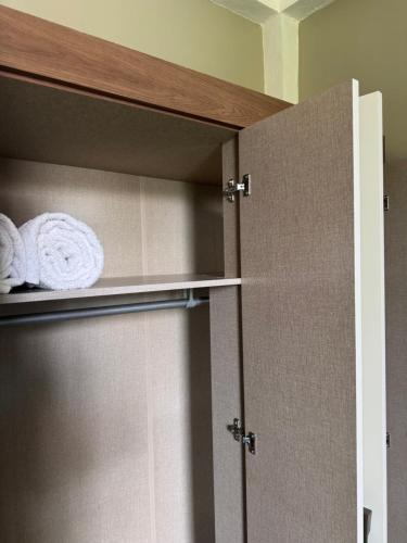 a cupboard with towels on it in a bathroom at Vacation Rental in Paix Bouche