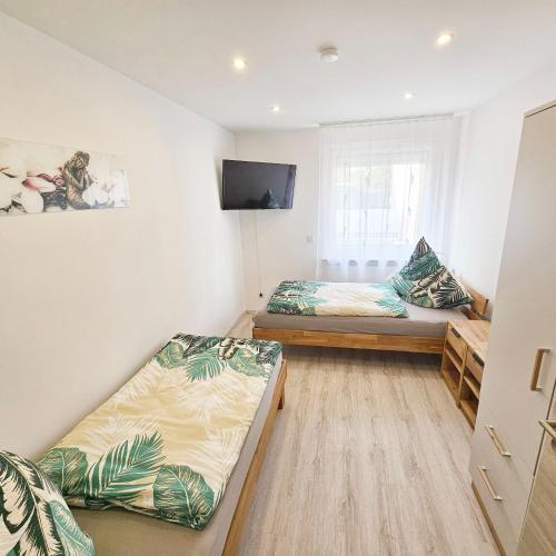 Ein Bett oder Betten in einem Zimmer der Unterkunft Ferienwohnung Popp Langen