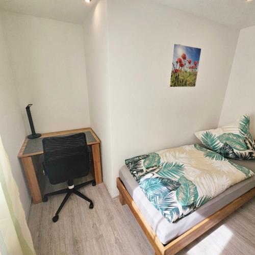 Ein Bett oder Betten in einem Zimmer der Unterkunft Ferienwohnung Popp Langen