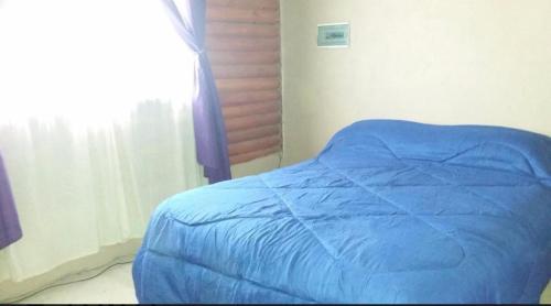 Ένα ή περισσότερα κρεβάτια σε δωμάτιο στο Casa para 8 personas en Nueva Atlantis