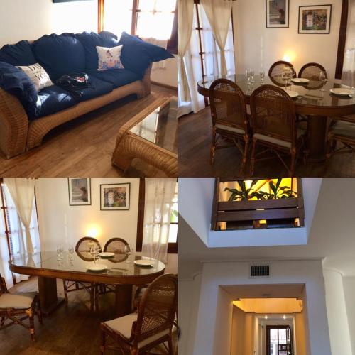 una sala de estar con un sofá y una mesa en Casa Recalada 5 dormitorios, en Monte Hermoso