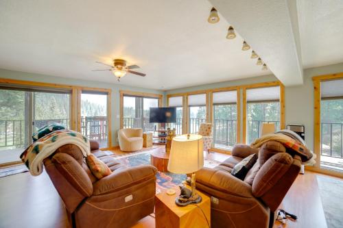 a living room with two leather chairs and a table at Mtn-View Oasis with Pool Access in Garden Valley in Garden Valley