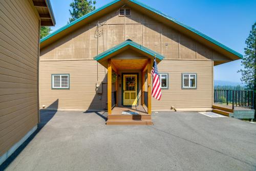 a building with a flag in front of it at Mtn-View Oasis with Pool Access in Garden Valley in Garden Valley