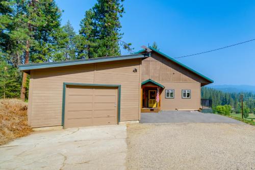 a garage with a large door in a driveway at Mtn-View Oasis with Pool Access in Garden Valley in Garden Valley