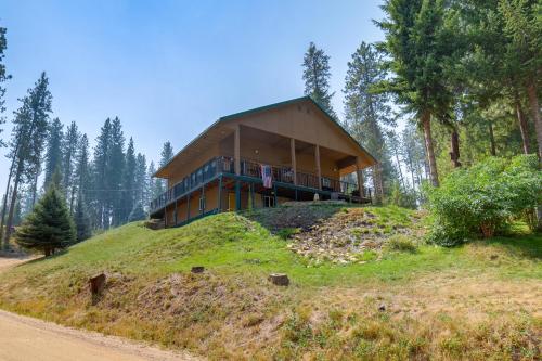 a house on top of a hill in the woods at Mtn-View Oasis with Pool Access in Garden Valley in Garden Valley