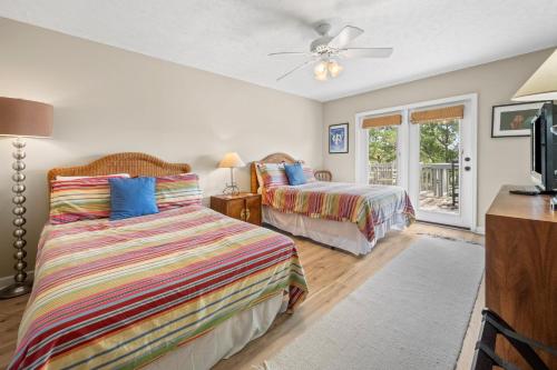 a bedroom with two beds and a window at Southern Dunes home by Peace Vacations in Georgetown