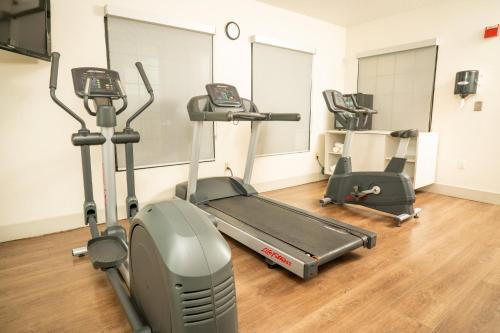 a gym with two tread machines and a treadmill at Holiday Inn Express Hotel & Suites Hesperia by IHG in Hesperia