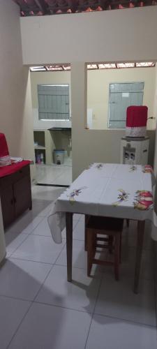 a kitchen with a table in the middle of a room at Casa de Lagoa Nova in Martins