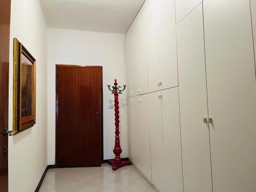 a hallway with a door and a pole in a room at Luxury Relax Apartment near Venice Station in Venice