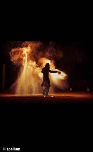 a person is standing in front of a fire at Bully casa Vacanze in Spello